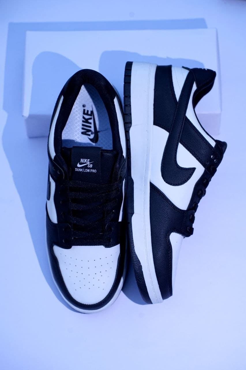 Nike Dunk Low Retro White Black Panda - In-Hand Angled Pair